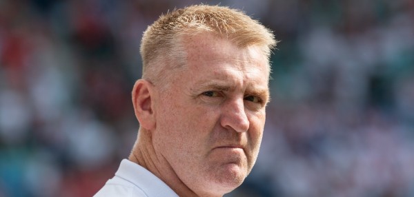 Dean Smith looks unhappy in a white shirt during a Norwich City match.